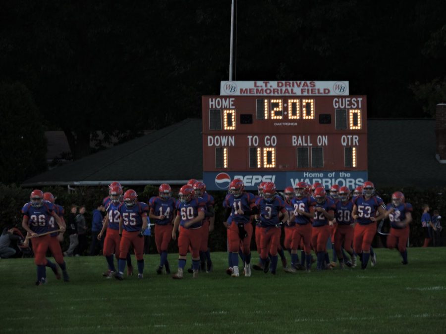 The Warriors march onto the field ahead of their matchup against the Warriors of Everett.