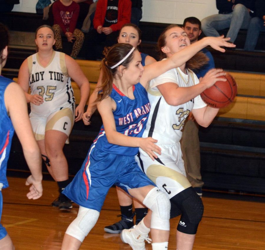 WB's Emily White blocks a shot of a Curwensville player