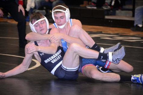 Tyler Denochick locks in a cradle against Carsyn Good of Mo Valley.