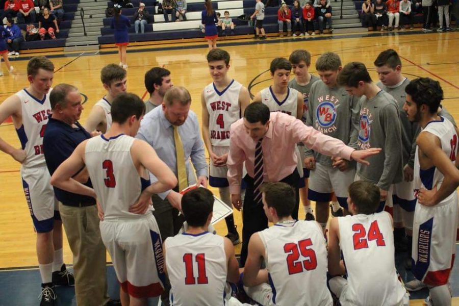 Coach Clark addresses the team during a timeout during a home game against Mount Union.