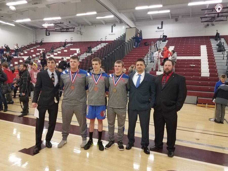 The Warrior Wrestlers and their coaches. (From left to right) Dave Williamson, Jacob Shaw, Tyler Denochick, Derek Yingling, Coach Bainey, George Yingling Photo courtesy of West Branch Warriors Wrestling.