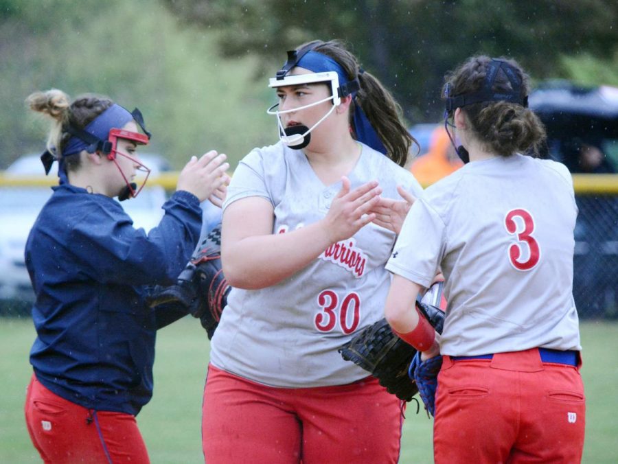 Emma Miller high fives Sarah Betts