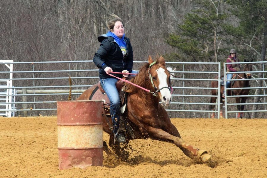 Sydney and her horse Duke round a barrel in a race. Dunlap won the barrel competition.