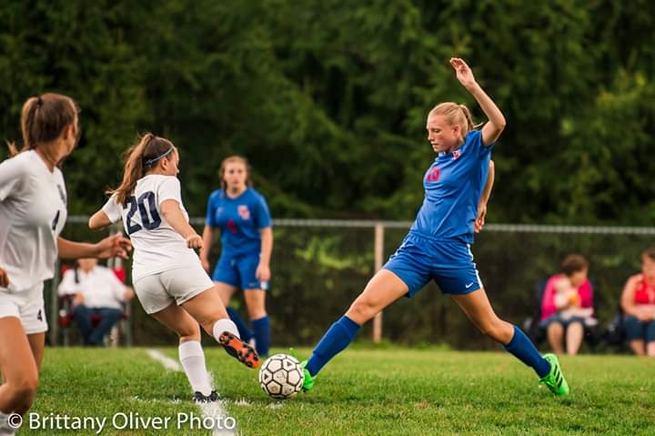 Madison Kephart steals the ball from an opponent.