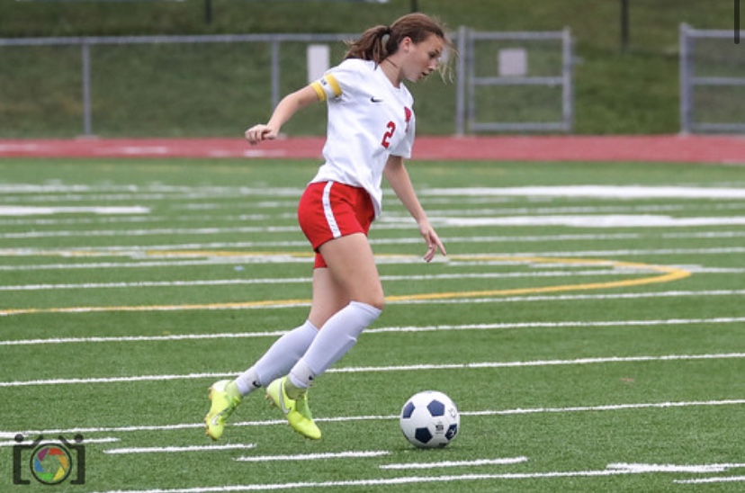 Trinity Prestash dribbles the ball on a break way, looking for a shot.