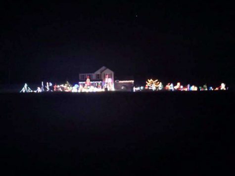 Noah Shingledecker's house decorated for Christmas with many exciting and bright lights and decorations.