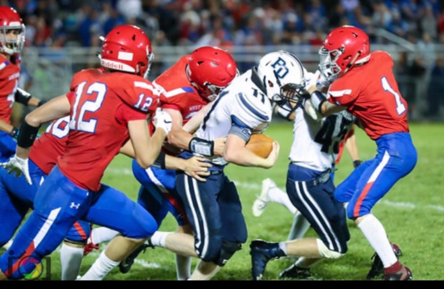 Picture of Aidan going after a PO football player