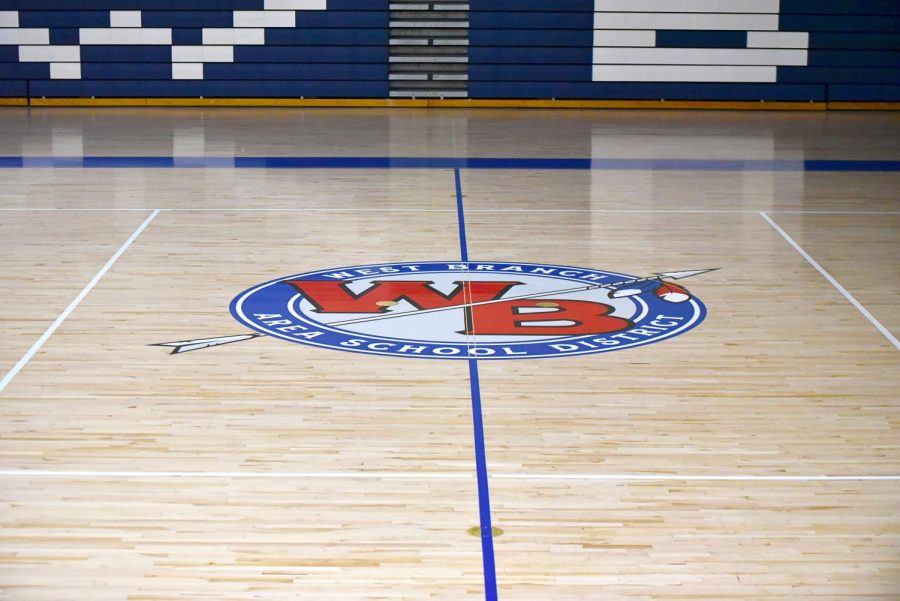 The schools logo sits at half-court on the new court design.