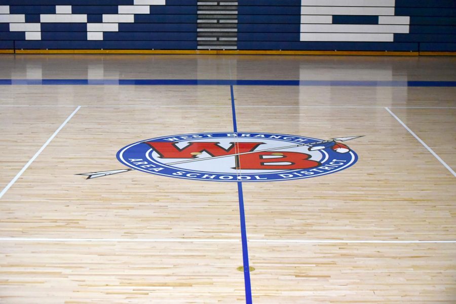 The school's logo sits at half-court on the new court design.