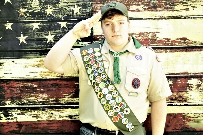 Jason poses for a photo in his Boy Scout uniform.