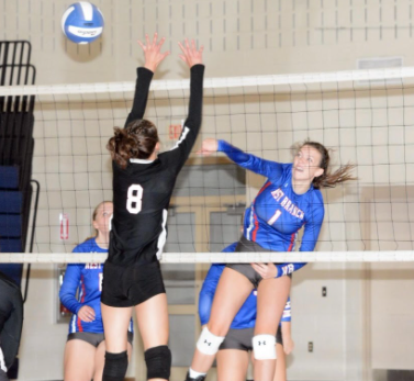 Senior Taylor Myers going up for the kill against a strong middle block.