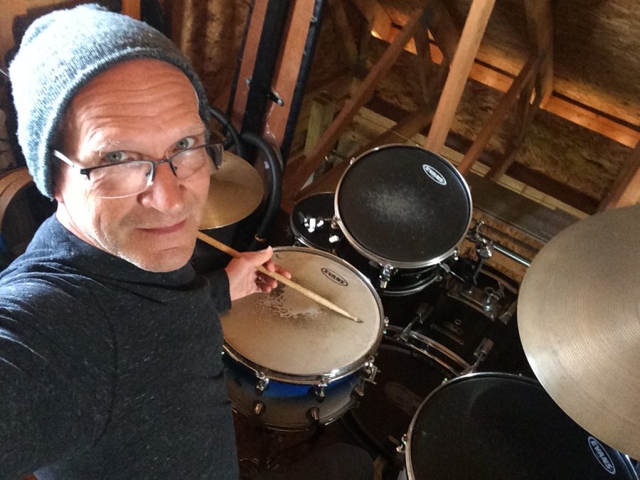 Mr.+Hughes+poses+for+a+selfie+at+home+with+his+drum+set.
