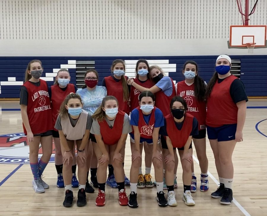 The Lady Warriors pose for a photo at the last practice before their first game.