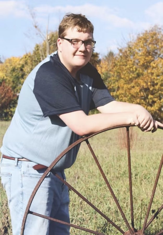 Nick+Shirey+posing+for+the+camera+for+a+snazzy+senior+photo.