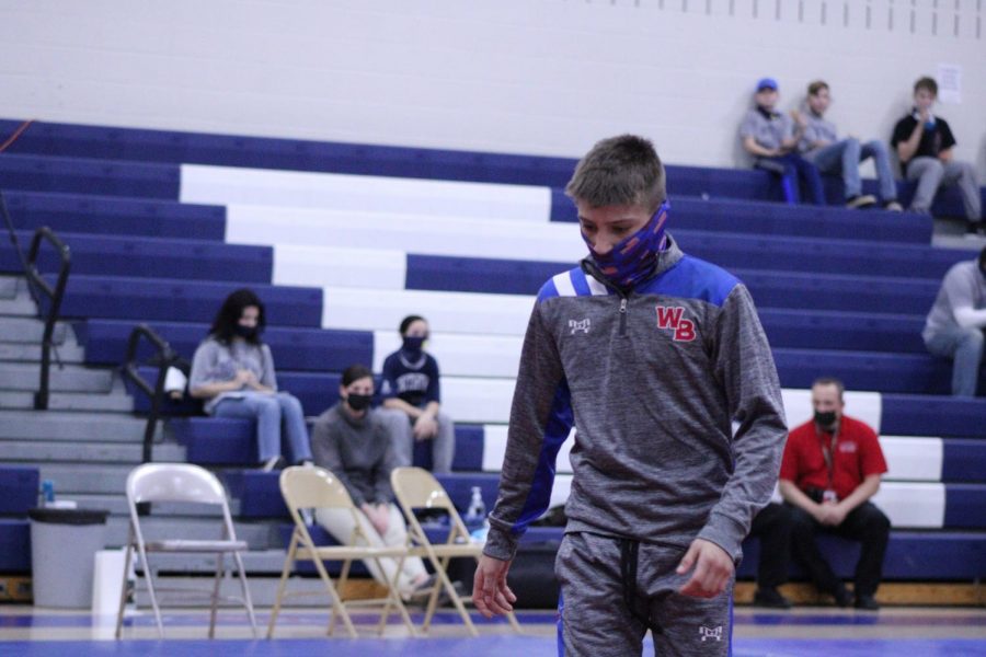 Freshman Landon Bainey prepares for a match against his opponent.