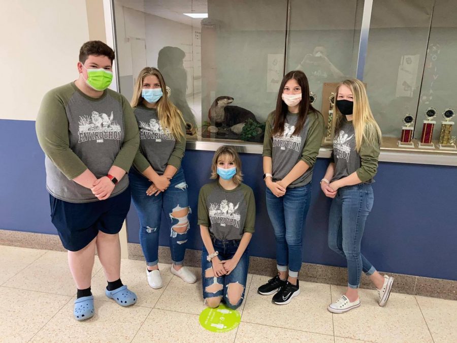 The team members of the envirothon team stand next to the otter which will remain at West Branch for another year after an impressive victory by the team.