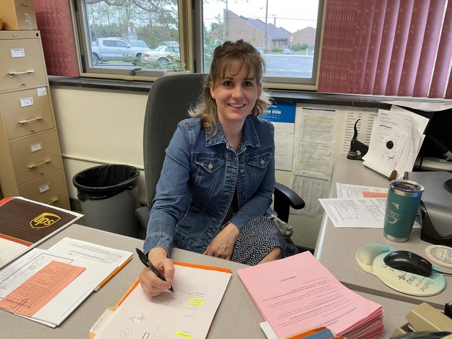 Mrs. Guenot at her desk getting ready to start the week.