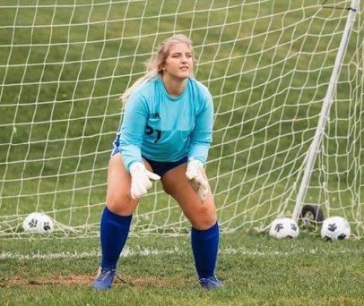 Katlyn Folmar anticipates the shot from an opposing player.