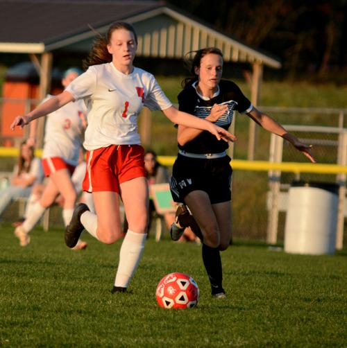 Guglielmi fends off an incoming defender from Moshannon Valley and wins the ball.