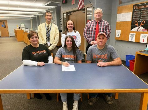 Olivia Straka at her signing alongside athletic director Davey Williams, Head West Branch soccer coach Angie Fenush, Principal Holenchik, and parents Jen and Mike Straka