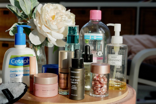 A variety of skincare products, including moisturizers and primers.
