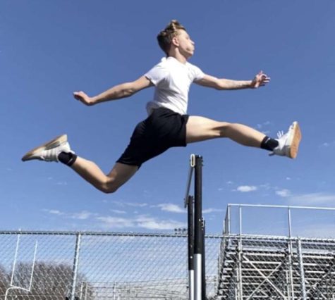Shae practices jumping hurdles on the practice track at L.T. Drivas Memorial Field.