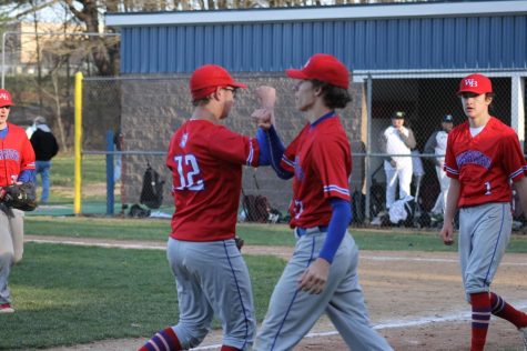 Teammates Zack Tiracorda and Luke Liptak celebrate after the win over Mo Valley
