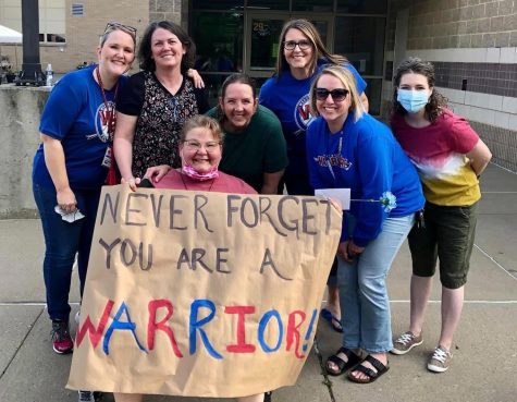 Mrs. Fry poses with her fellow staff members at the Senior Farewell Parade in 2020.