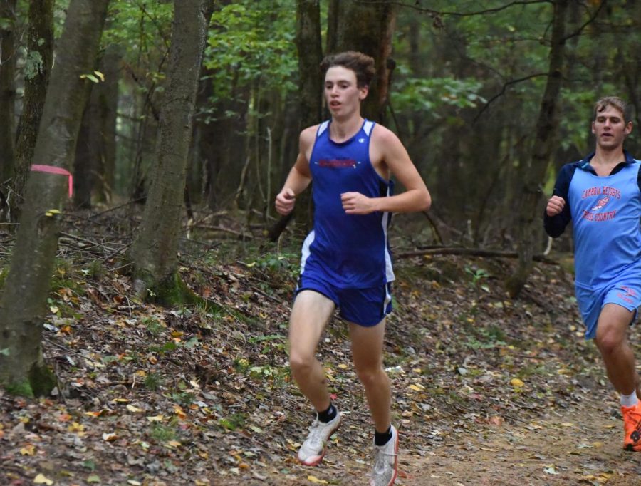 Noah Ryder passes Cambria Heights runner and finishes first.