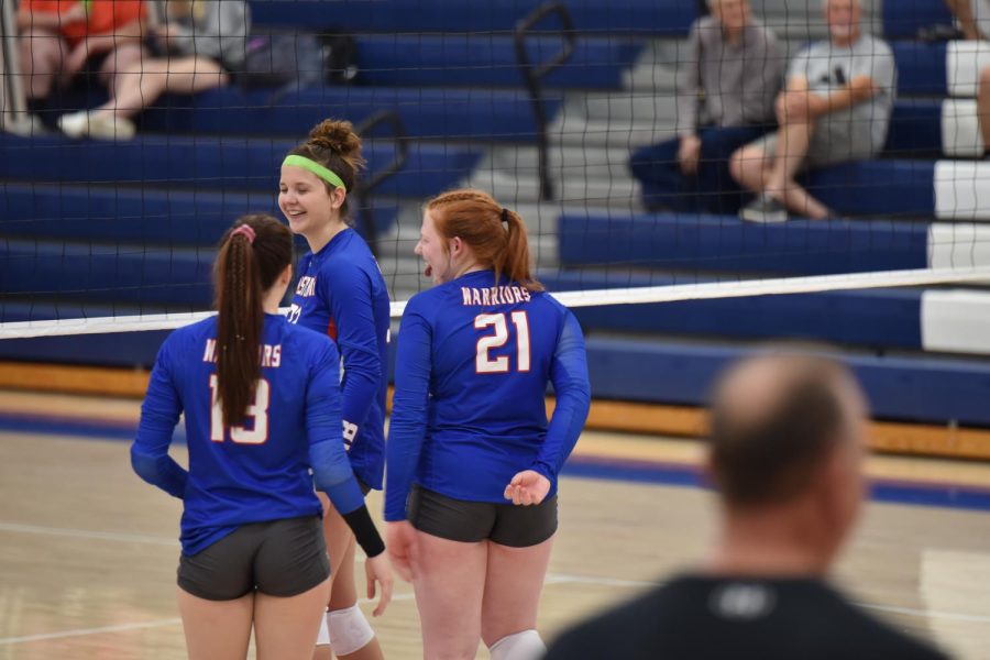 The junior trio celebrates after a kill made by Brooklyn.