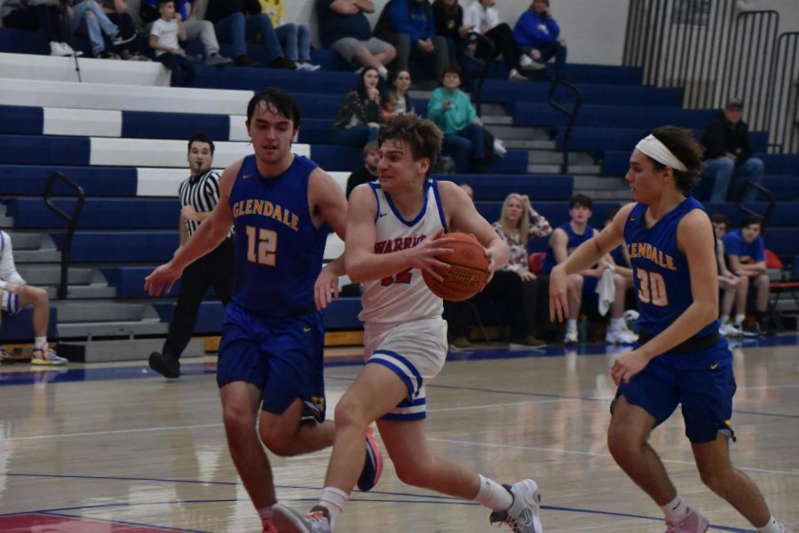 Owen Koleno drives to the basket against Glendale to draw a foul while making the shot.