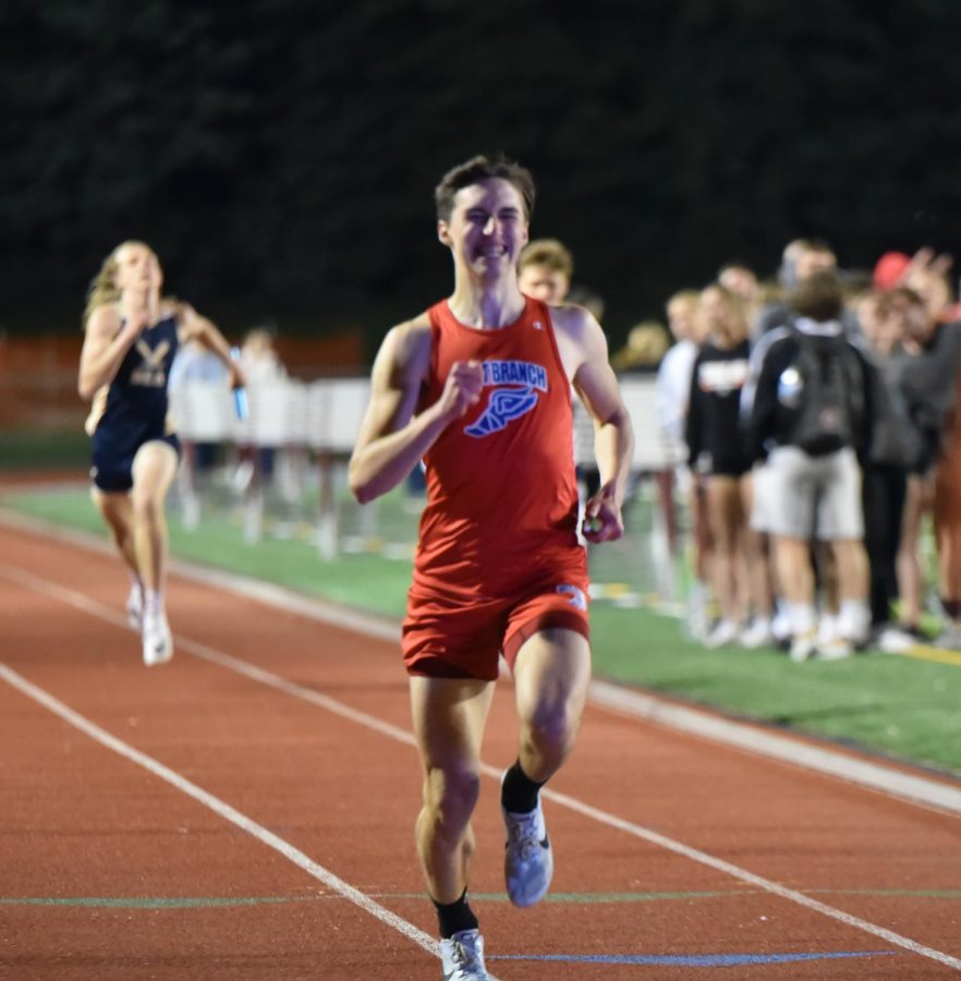 Sage Car runs in the 4x800 relay in the 2022 District Playoff meet.
