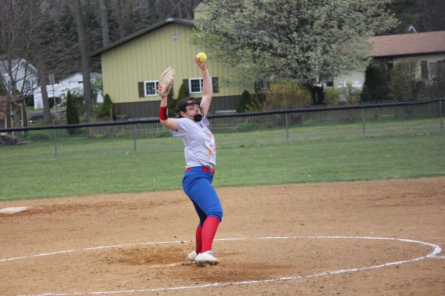 Makena Moore winds-up to throw a pitch to the plate during a home game.