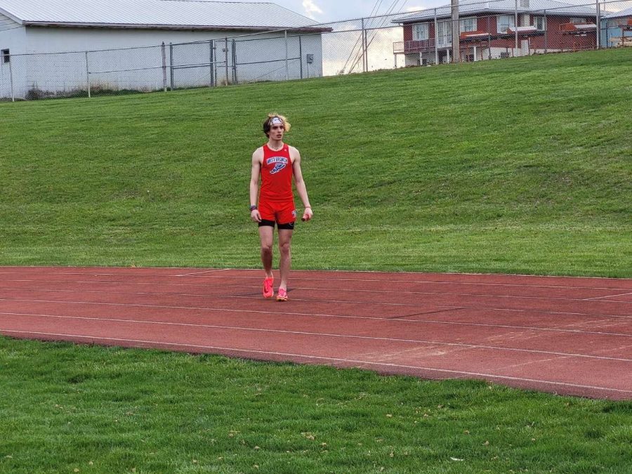John running at one of the previous 2023 season Track and Field meets.