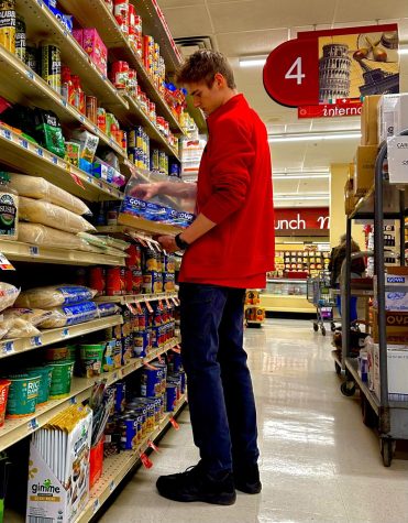 A picture of Drake Witherite stocking shelves during a shift at Weis.
