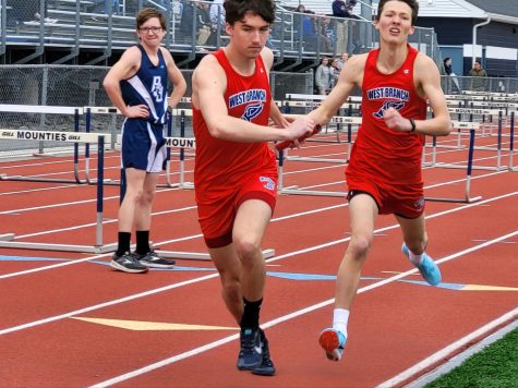 Sage Carr and Jacob Alexander competing in the relay at a meet against Philipsburg-Osceola.