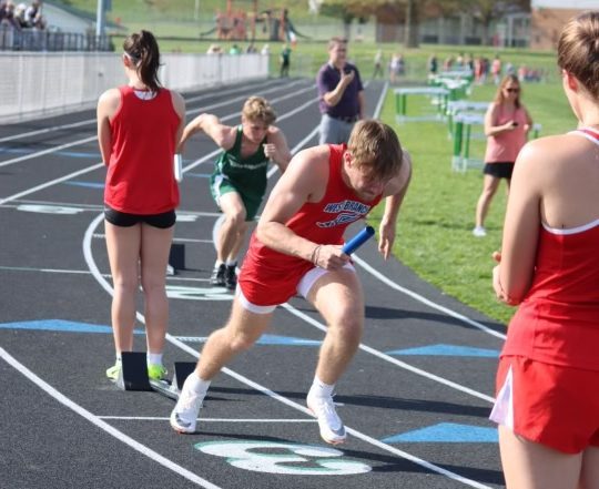 Wyatt Schwiderske runs out of blocks for the first leg in the 4x100 relay.
