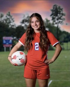 Kaylea stands tall as she gets her picture taken for soccer.

