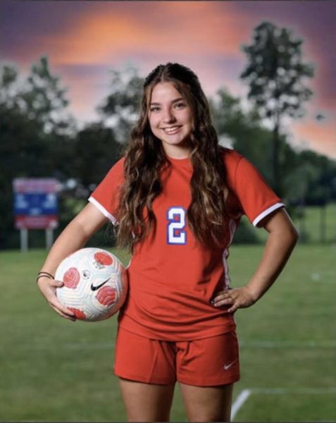 Kaylea stands tall as she gets her picture taken for soccer.

