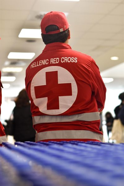 A photo of a Red Cross employee wearing their uniform.

