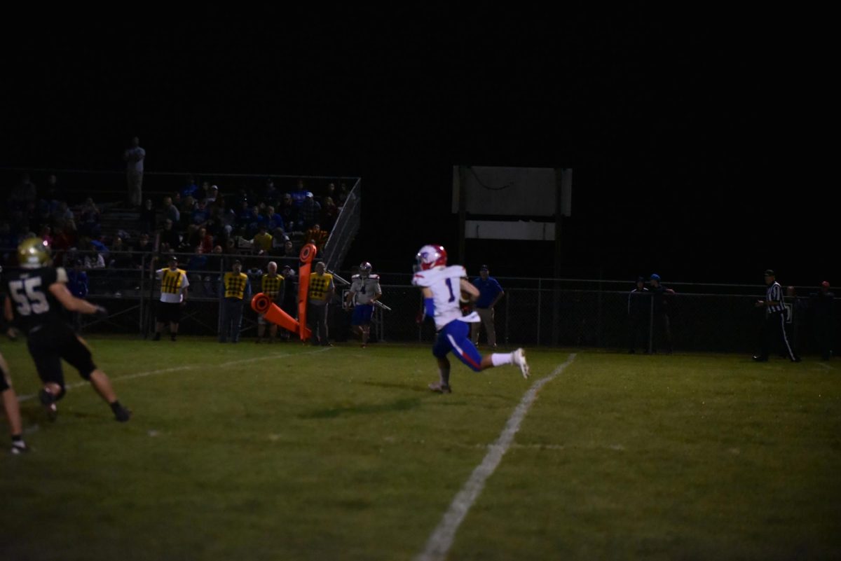 Nick Stavola running with the ball in an away game against Curvensville.