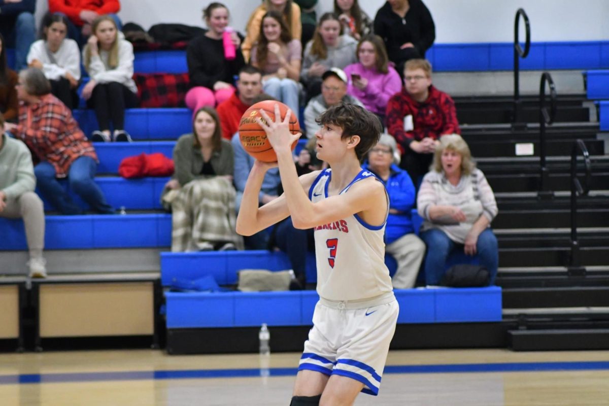 Dylan McGonigal takes a three against McConnellsburg on Friday night.
