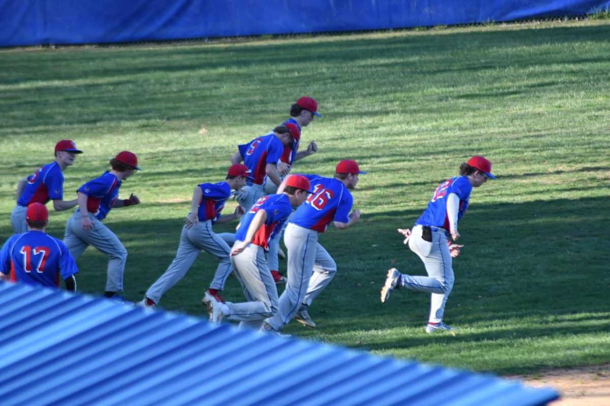 The West Branch Boys Baseball team warming up for their game against Bucktail.