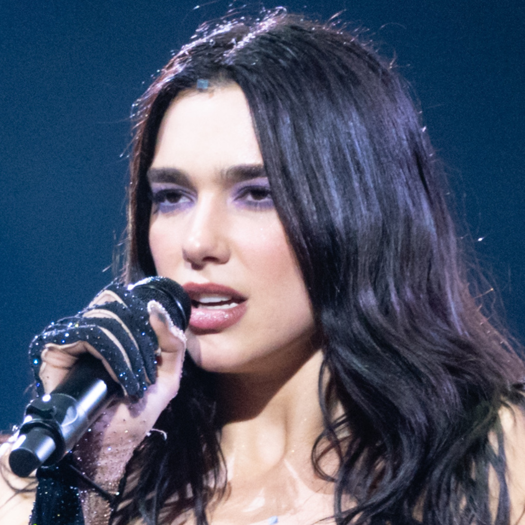 A picture of pop star Dua Lipa during a live performance.