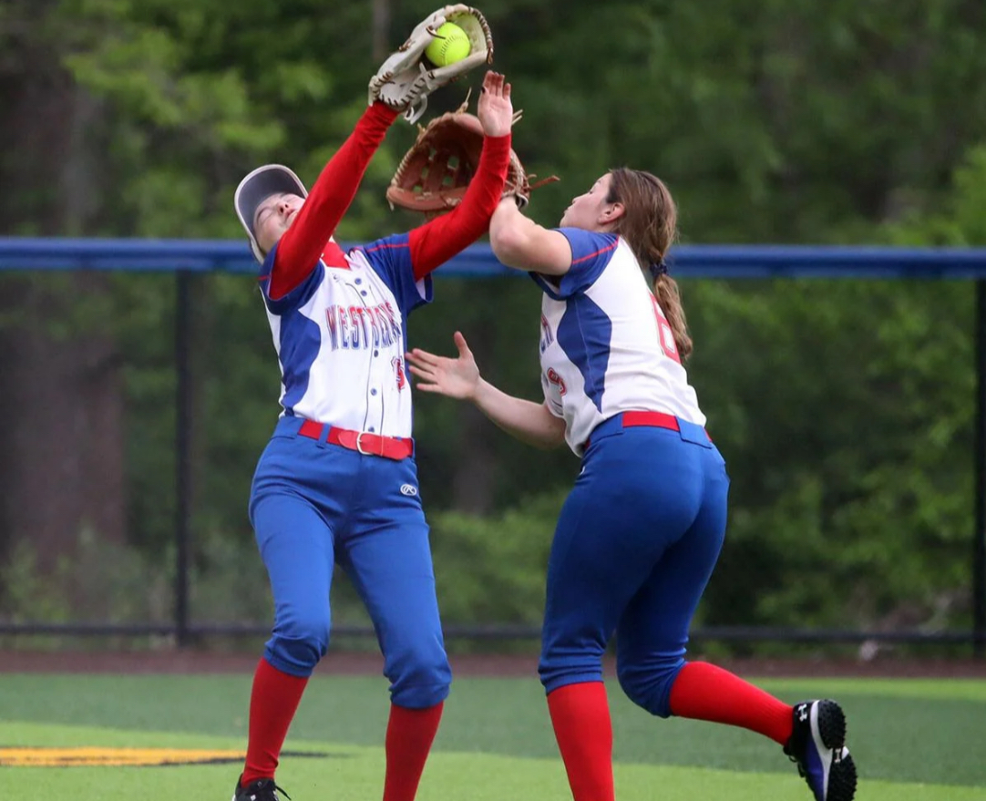 Senior Mallory Graham making a catch while colliding with junior Layla Thompson. 