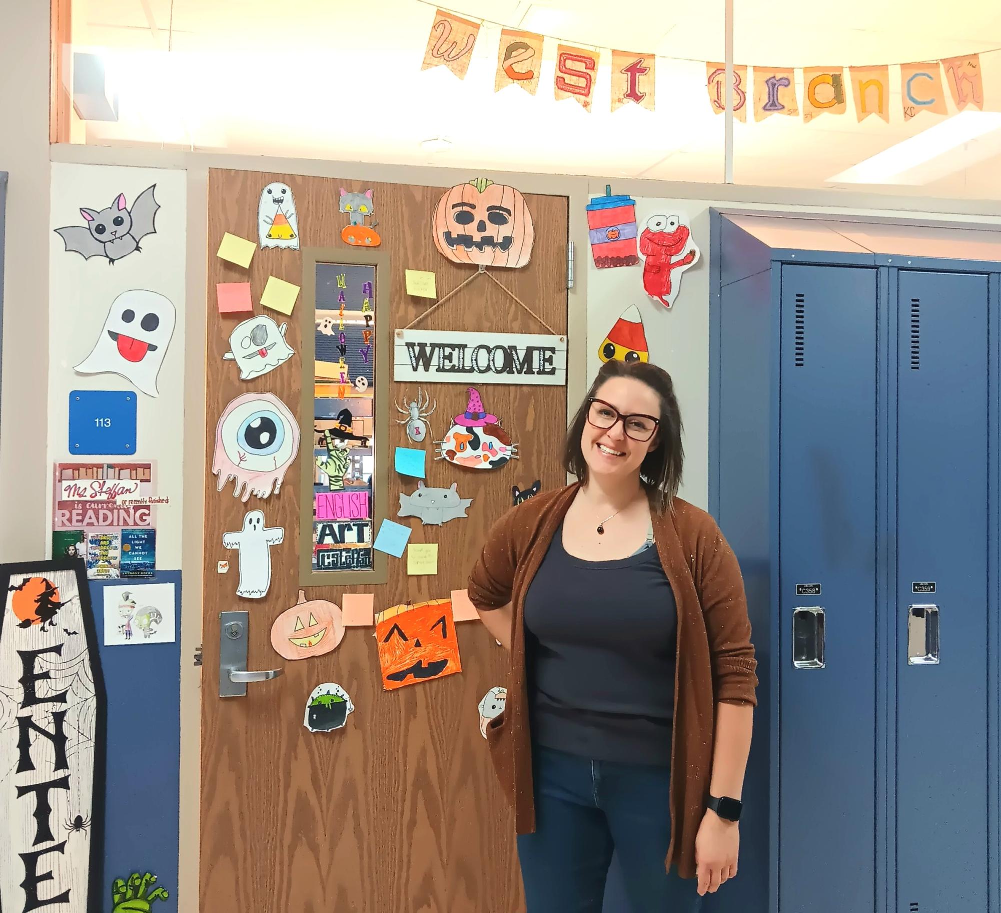 West Branch’s art and English teacher, Rachel Steffan, stands in front of her fun and decorated door.