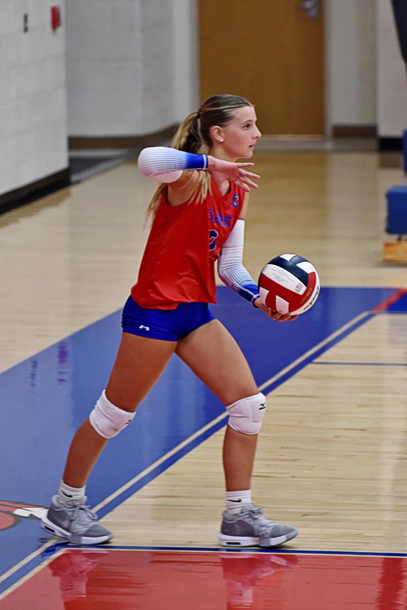 Brielle Bainey brings a powerful serve during the Warriors' home opener against the Claysburg-Kimmel Bulldogs.