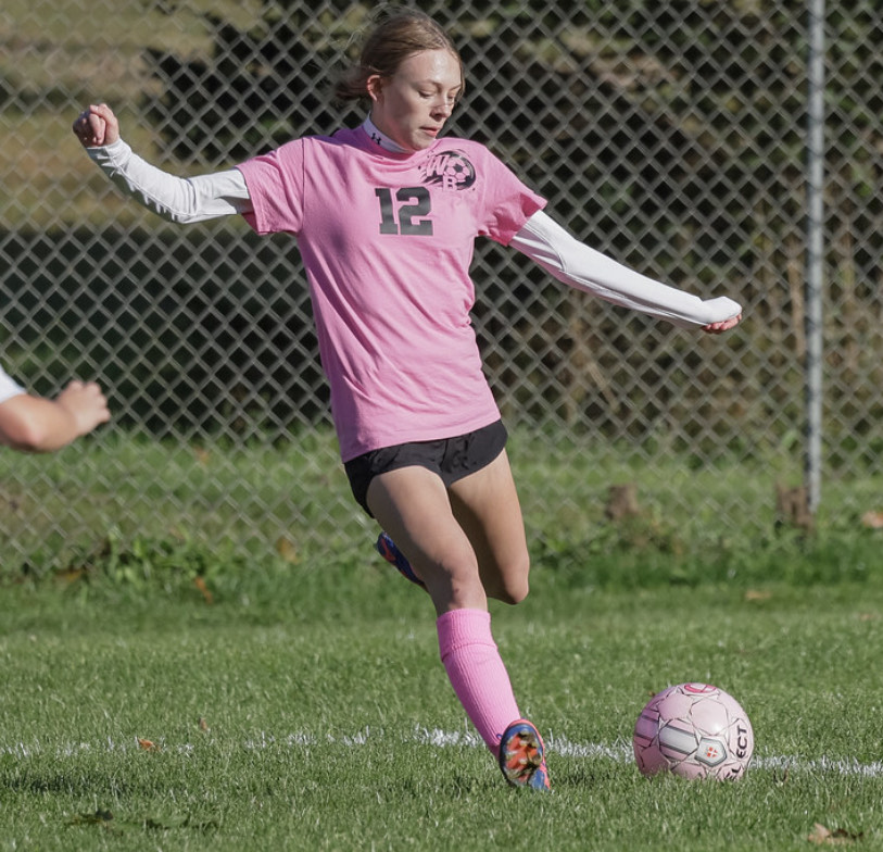 Sydney Sankey demonstrates her skills with a powerful kick during the Pink Out game against Moshannon Valley.