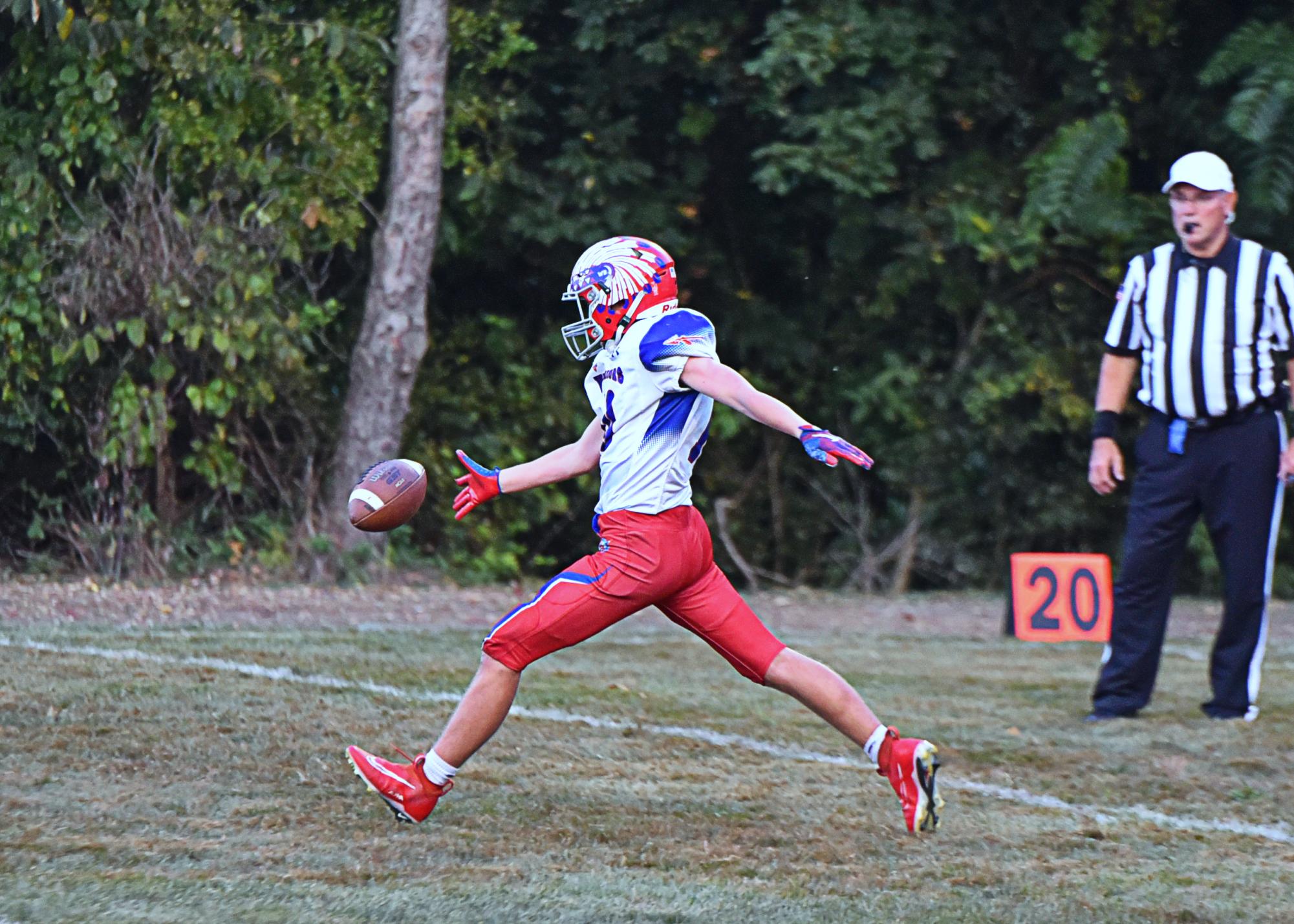 Coby Kephart punts against the co-op Juniata Valley Hornets at Williamsburg.