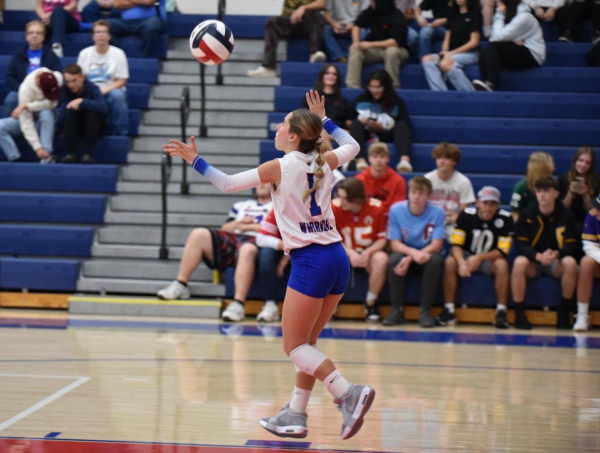 Kyla Kephart gets ready to serve in the Warriors win against Williamsburg